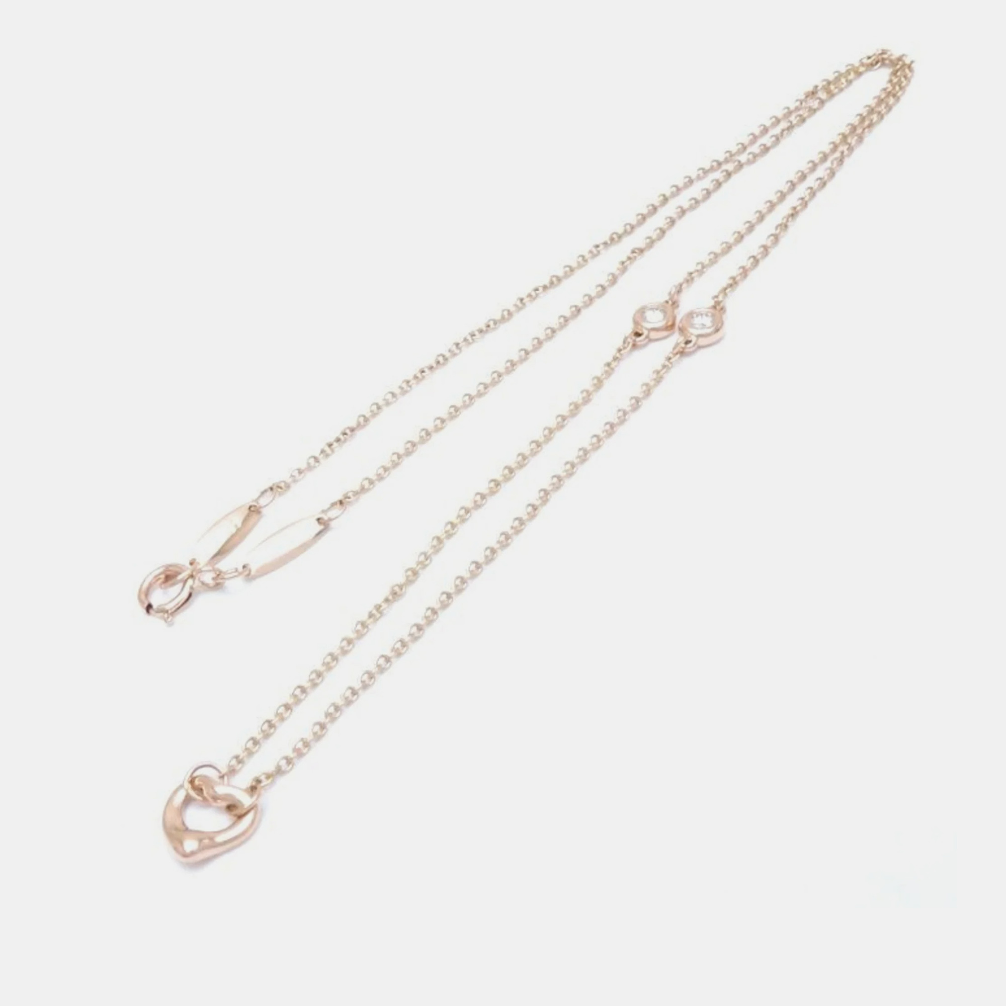 Tiffany & Co. 18K Rose Gold and Diamond Elsa Peretti Open Heart Pendant Necklace
Tiffany & Co. 18K Rose Gold and Diamond Elsa Peretti Open Heart Pendant Necklace