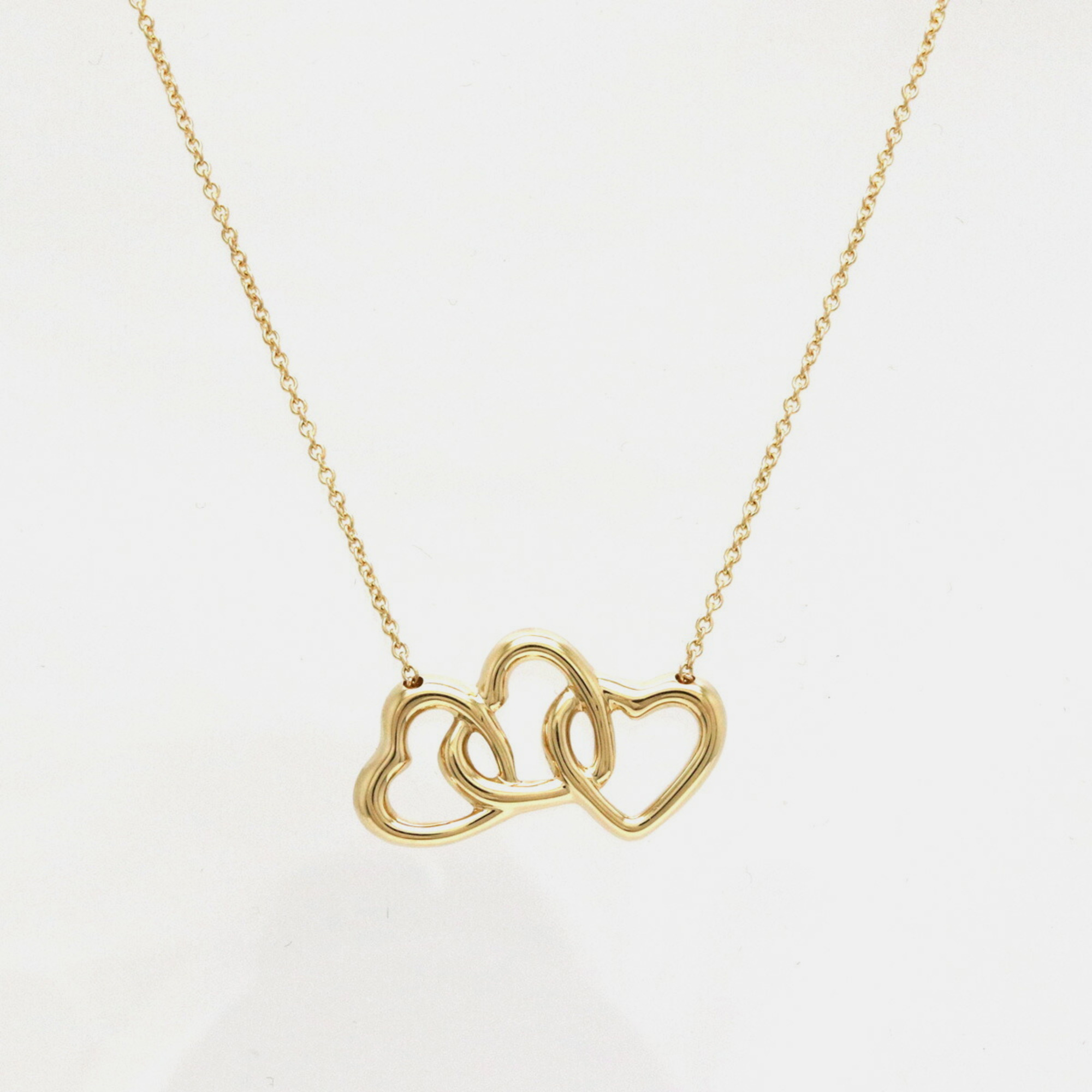 Tiffany & Co. 18K Yellow Gold Tiffany Triple Open Heart Pendant Necklace
Tiffany & Co. 18K Yellow Gold Tiffany Triple Open Heart Pendant Necklace