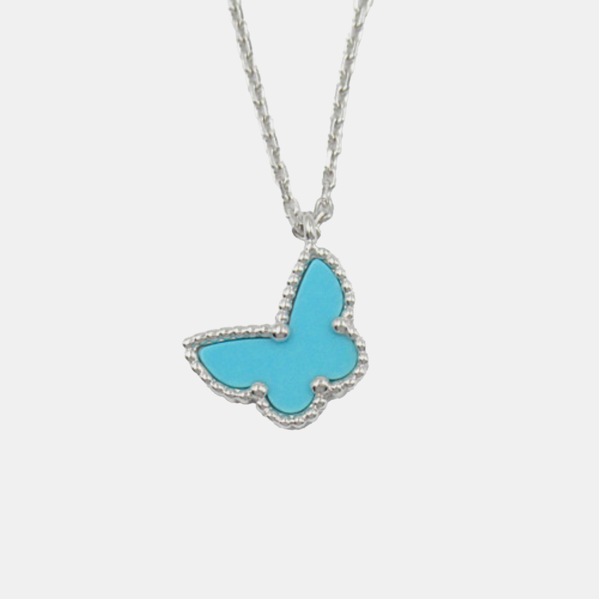 Van Cleef & Arpels 18K White Gold and Turquoise Sweet Alhambra Butterfly Pendant Necklace
Van Cleef & Arpels 18K White Gold and Turquoise Sweet Alhambra Butterfly Pendant Necklace