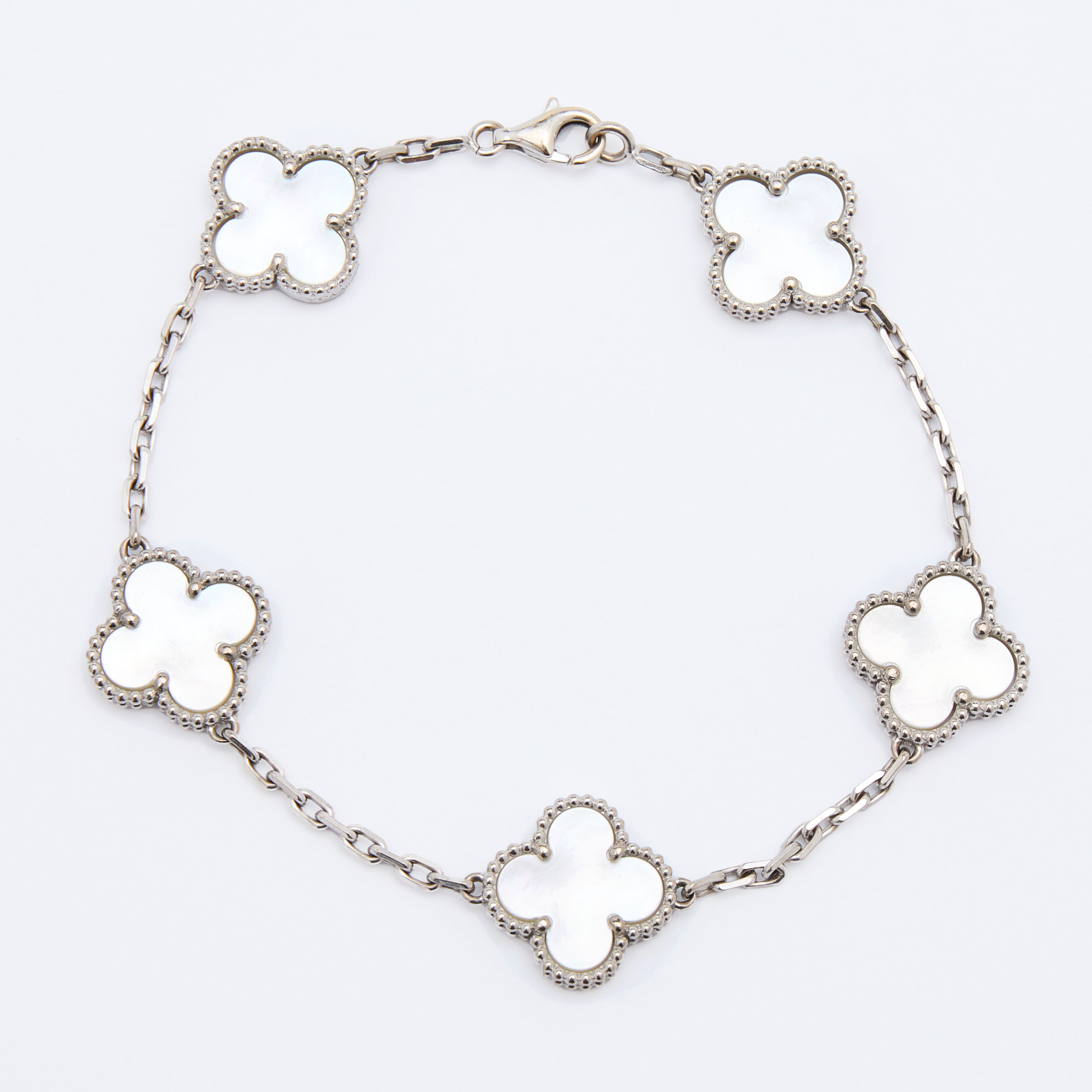 Van Cleef & Arpels Vintage Alhambra Mother of Pearl 18k White Gold Station Bracelet 
Van Cleef & Arpels Vintage Alhambra Mother of Pearl 18k White Gold Station Bracelet