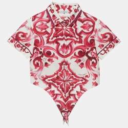 Pre Owned ```json
{"name_ar": "طقم توب وتنورة من دولتي آند غابانا كيدز بطبعة ماجوليكا أبيض/وردي قطن 7/8 سنوات"}
```