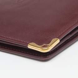 Pre Owned محفظة كارتييه موست دو  كارتييه 6 سي سي جلد أحمر داكن ثنائية الطية