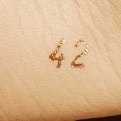 مملوكة مسبقًا Christian Louboutin Orange Leather Spikes Cap Toe Slip On Sneakers Size 42