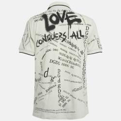 مملوكة مسبقًا تي شيرت بولو دولتشي أند غابانا بيكيه قطن كريمي بحروف دي جي مقاس إكس إكس لارج