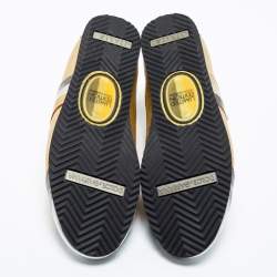 مملوكة مسبقًا حذاء رياضي دولتشي أند غابانا جلد ذهبي /فضي ميتالك نقشة جي جي عنق منخفض إصدار محدود مقاس 40 