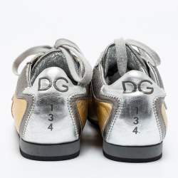 مملوكة مسبقًا حذاء رياضي دولتشي أند غابانا جلد ذهبي /فضي ميتالك نقشة جي جي عنق منخفض إصدار محدود مقاس 40 