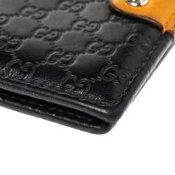 مملوكة مسبقًا Gucci Black/Mustard GG Microguccissima Leather Bifold Wallet