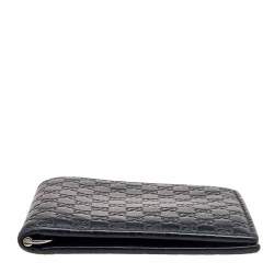 مملوكة مسبقًا Gucci Black Microguccissima Leather Money Clip Bifold Wallet