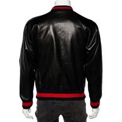 Pre Owned جاكت منفوخ غوتشي أبليك حروف دي أي واي جلد أسود مقاس متوسط