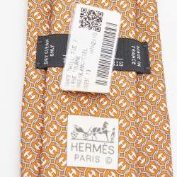 Pre Owned Hermès Orange 7 La Roue Tourne Printed Silk Slim Tie