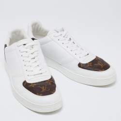 مملوكة مسبقًا Louis Vuitton White/Brown Leather and Monogram Canvas Rivoli Low-Top Sneakers Size 41.5