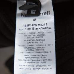 Pre Owned شورت نيل باريت قصه سلوش مزين رمز الصاعقة أسود و أصفر مقاس وسط (ميديوم)