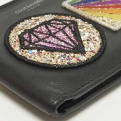 مملوكة مسبقًا محفظة بطيتيين سان لوران بقع جلد أسود