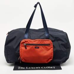 Pre Owned TUMI Navy Blue/Orange Nylon Foldable Compact Duffle Bag