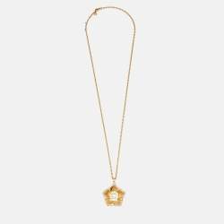 Aigner Gold Tone Crystal Logo Flower Pendant Necklace