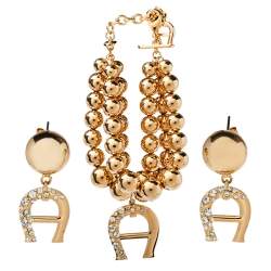 Aigner Gold Tone Layered Bracelet and Logo Drop Earrings Set
