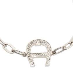 Pre Owned Aigner Silver Tone Crystal Logo Toggle Bracelet