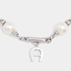 Pre Owned Aigner Silver Tone Logo Charms Pearl Station Bracelet