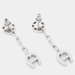 Pre Owned Aigner Silver Tone Crystal Logo Drop Earrings