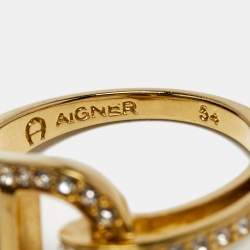Pre Owned Aigner Gold Tone Crystal Embellished Logo Ring Size EU 54