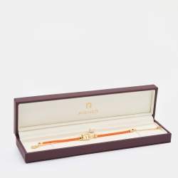 Pre Owned Aigner Orange Silk Cord Crystal Logo Yael Bracelet