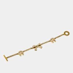 Pre Owned Aigner Bow Crystals Gold Tone Bracelet