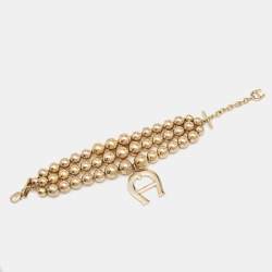 Pre Owned Aigner Bedazzled Gold Plated Crystal Logo Bracelet