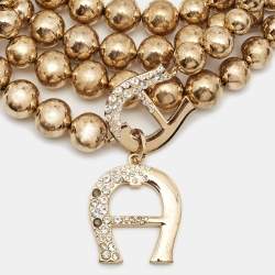 Pre Owned Aigner Bedazzled Crystal Gold Tone Multistrand Necklace