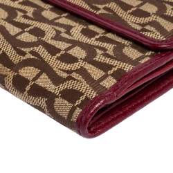 مملوكة مسبقًا محفظة أيغنر ثلاثية الطيه جلد و كانفاس بالشعار عنابي و بني 