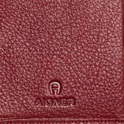 مملوكة مسبقًا محفظة أيغنر ثلاثية الطيه جلد و كانفاس بالشعار عنابي و بني 