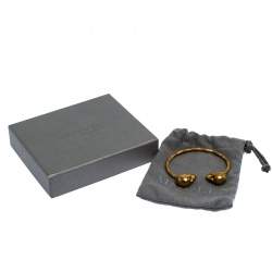 Pre Owned Alexander McQueen Crystal Twin Skull Textured Gold Tone Open Cuff Bracelet 