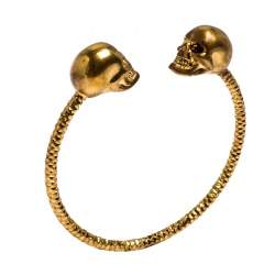 Pre Owned Alexander McQueen Crystal Twin Skull Textured Gold Tone Open Cuff Bracelet 