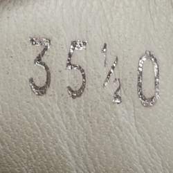 Pre Owned حذاء رياضي ألكساندر ماكوين لاري جلد أبيض / ذهبي مقاس أوروبي  36.5