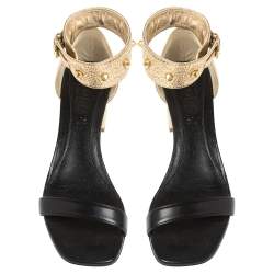 Pre Owned Alexander McQueen Gold/Black Leather Studded Ankle Wrap Sandals 39