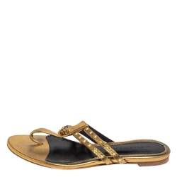 Pre Owned Alexander McQueen Metallic Gold Leather Embellished Skull Flat Thong Sandals Size 38