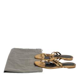 Pre Owned Alexander McQueen Metallic Gold Leather Embellished Skull Flat Thong Sandals Size 38