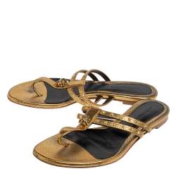 Pre Owned Alexander McQueen Metallic Gold Leather Embellished Skull Flat Thong Sandals Size 38