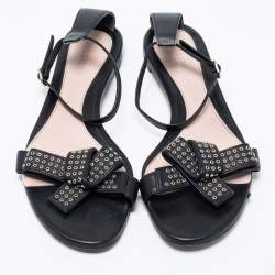 Pre Owned Alexander McQueen Black Leather Eyelet Embellished Bow Flat Ankle Strap Sandals Size 40