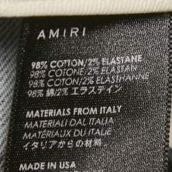 مملوكة مسبقًا بنطلون جينز ضيق أميـري دينم أزرق مرشوش بالطلاء وممزق مقاس متوسط (ميديام) خصر 29 بوصة