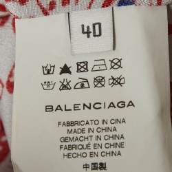 مملوكة مسبقًا بلوزة بالنسياغا حرير بطبعة زهور بيضاء/حمراء مقاس متوسط (ميديم)