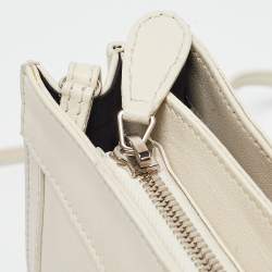 مملوكة مسبقًا Balenciaga Off White Leather Perforated Logo Pochette Bag