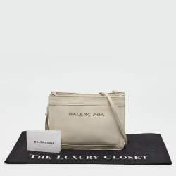 مملوكة مسبقًا Balenciaga Off White Leather Perforated Logo Pochette Bag