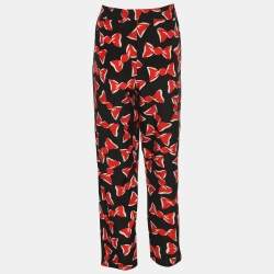 مملوكة مسبقًا بنطلون بوتيك موسكينو حرير مطبوع باللونين الأسود والأحمر مع فيونكة متوسط