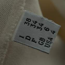 Pre Owned Boutique Moschino Cream Stretch Knit Ruffled Hem Top S