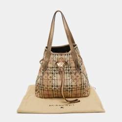 مملوكة مسبقًا Burberry Gold/Beige Laser Cut Haymarket Check Coated Canvas and Leather Drawstring Shoulder Bag