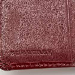 Pre Owned Burberry Burgundy Nova Check Stars PVC and Patent Leather Flap French Wallet