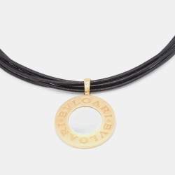 Pre Owned Bvlgari Bvlgari Onyx Mother of Pearl Stainless Steel 18k Yellow Gold Black Leather Cord Pendant Necklace