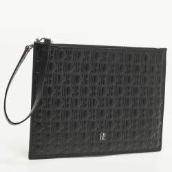 Pre Owned Carolina Herrera Black Monogram Embossed Leather Wristlet Pouch