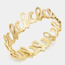 Carolina Herrera Gold Tone Logo Bangle Bracelet 