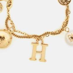 Carolina Herrera CH Faux Pearl Gold Tone Charm Bracelet